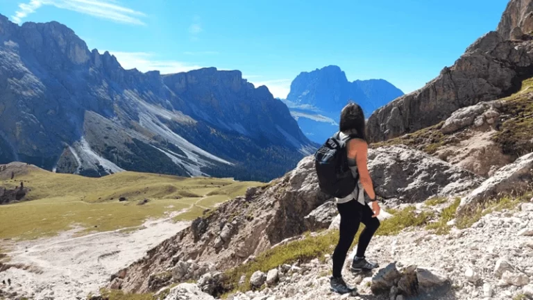 Kati Troeva hiking in the Dolomites, symbolizing exploration and the journey behind RankTrails — where travel meets search visibility.