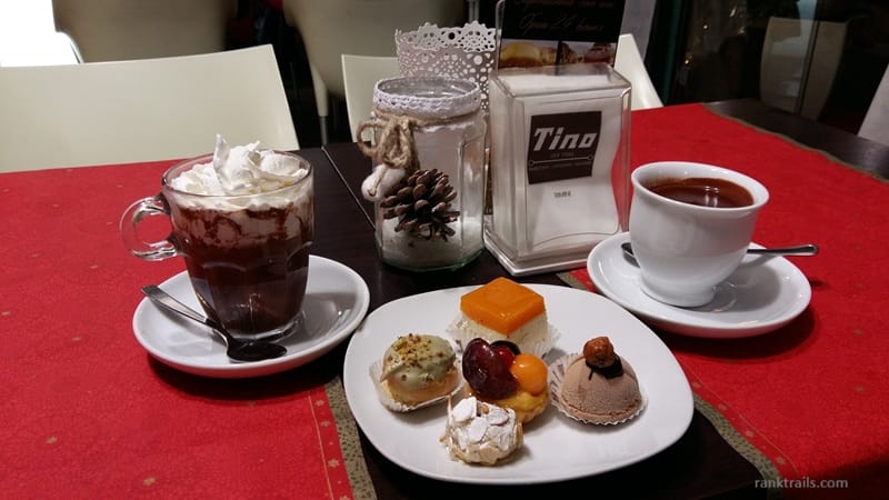 Hot chocolate, tea, and small pastries served at Café Tino in Rimini, Italy, near the seafront